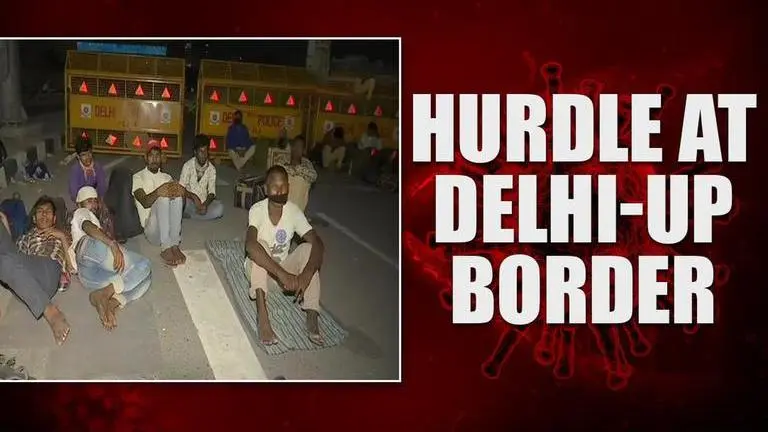 COVID-19: Migrant workers walking back to native place face hurdle at Delhi-UP border covid