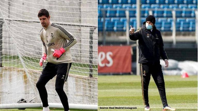 Real Madrid manager Zinedine Zidane wears a protective mask as team ...