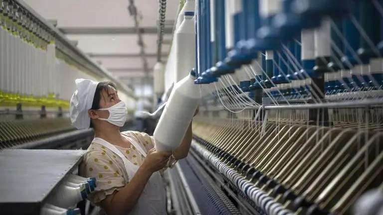 China's manufacturing improves in July, exports strengthen