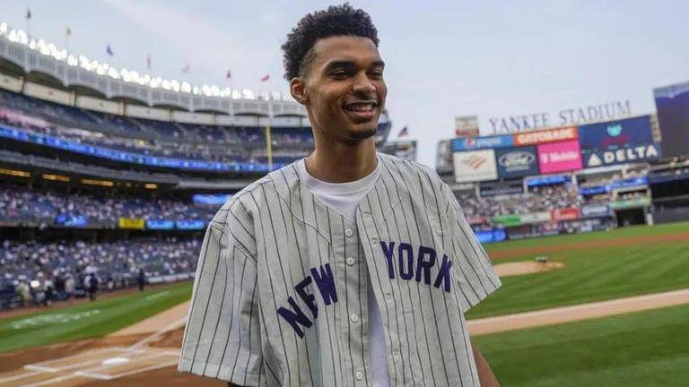 Nba: victor wembanyama throws ceremonial first pitch at yankees-mariners game ahead of nba draft