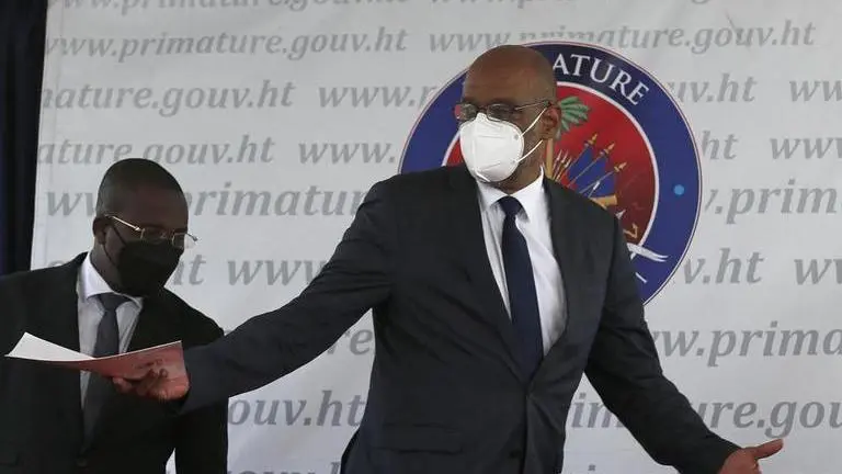 Haiti PM, under lens for alleged role in President's murder, barred from leaving country PM Ariel henry