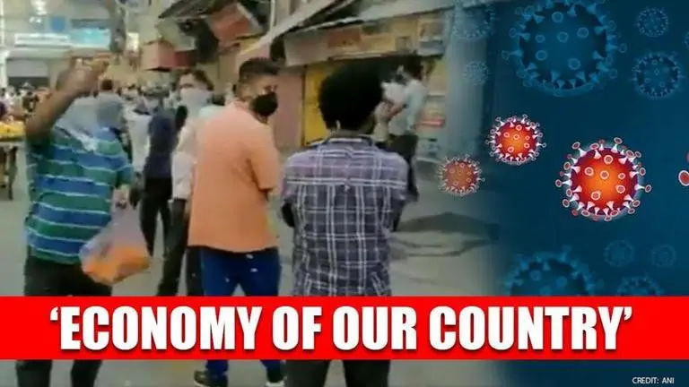 Man showers petals on liquor shop queue in Delhi; hails them as economy's saviours; Watch Delhi