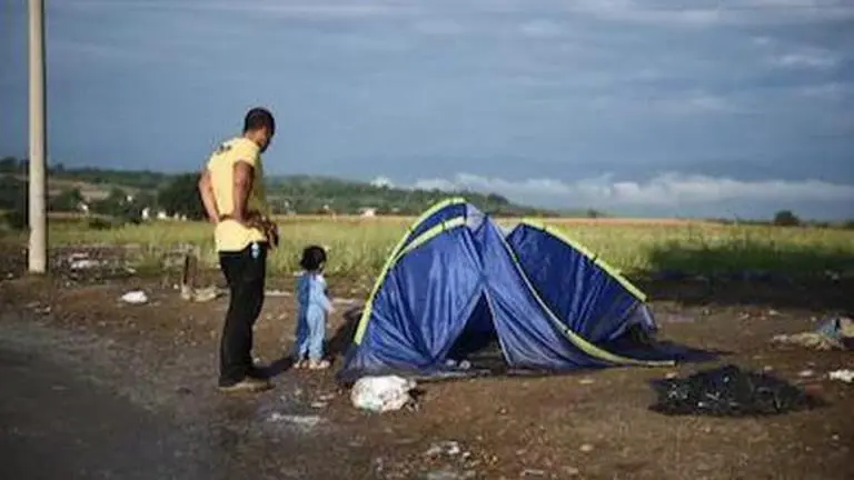 Greece: 2 migrants hurt as shots fired into island camp