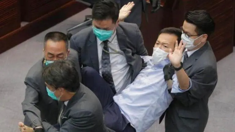 Hong Kong police detain journalist over programme based on Yuen Long station attack Hong Kong