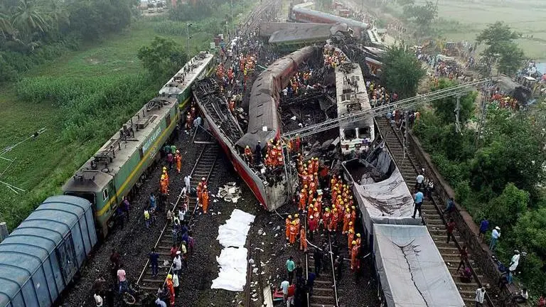 Rescuers attempt to raise buried coach at triple rail crash site; Indian Railways orders high-level probe The triple train crash in Odisha leaves over 900 injured and at least 261 people killed