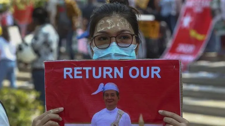 Pro-military marchers in Myanmar attack anti-coup protesters