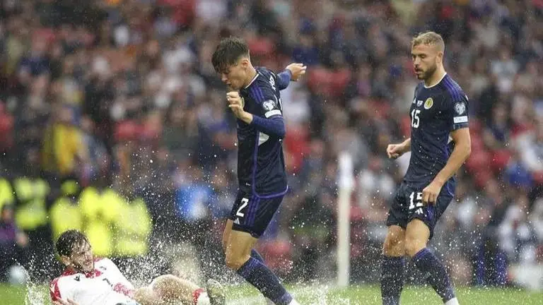 Heavy rain, flooded playing surface forces long delay during European soccer qualifier Heavy rain, flooded playing surface forces long delay during European soccer qualifier in Scotland
