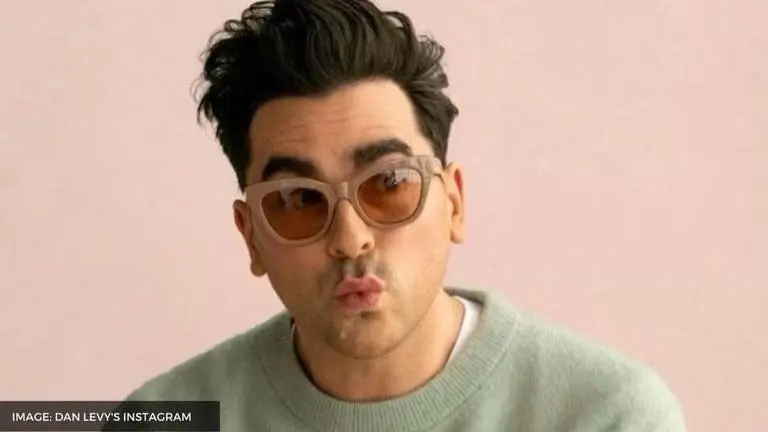 Dan Levy sports a moustache as he runs into his 'favourite witch'; see picture Dan Levy