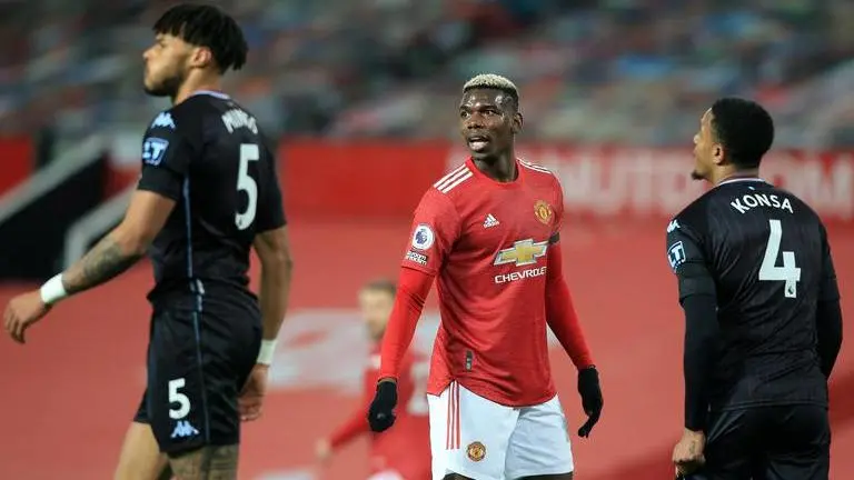 Man United beats Villa 2-1, level on points with Liverpool