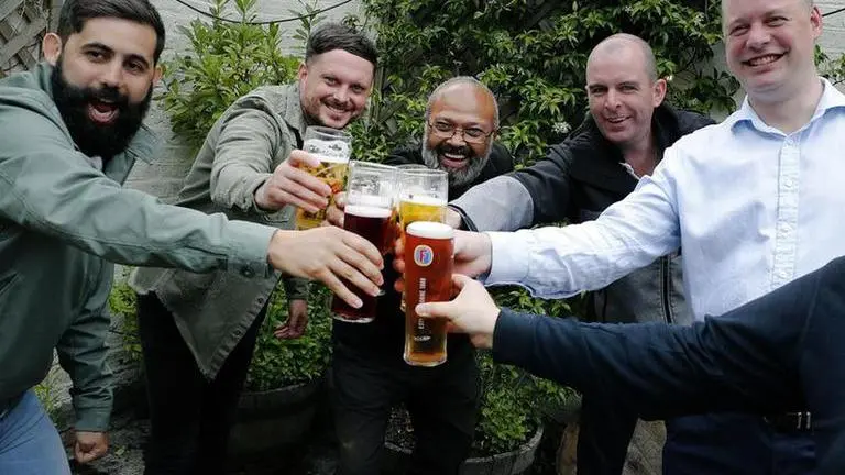 UK pubs, barbers reopen for first time in months