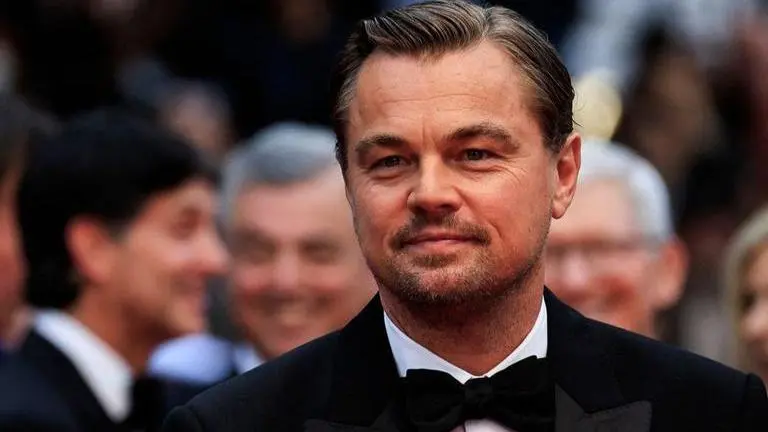 Leonardo DiCaprio's portrait sold for $1.3 million at Cannes gala, actor brings mom along Leonardo DiCaprio