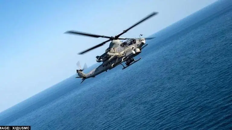 Cobra Helicopter of Marine Corps conducts ops over Pacific AH1Z Cobra helicopter of the US Marines has conducted flight operations over the Pacific Ocean