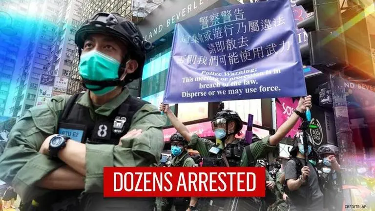 Hong Kong police arrest protestors for 'unauthorised gathering' on China's National Day Hong Kong police make arrests, protesters chant pro-democracy slogans