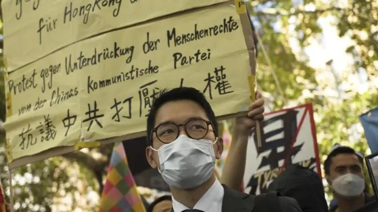 Hong Kong leader claims eight overseas activists issued with arrest warrants will be 'pursued for life' Pro-democracy activists stage protest in Hong Kong (Image: AP)