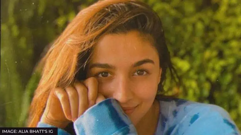 Alia Bhatt visits a beach to recreate a rare childhood pic; says 'no matter who we are' ALIA BHATT RECREATES A CHILDHOOD PIC ON A BEACH