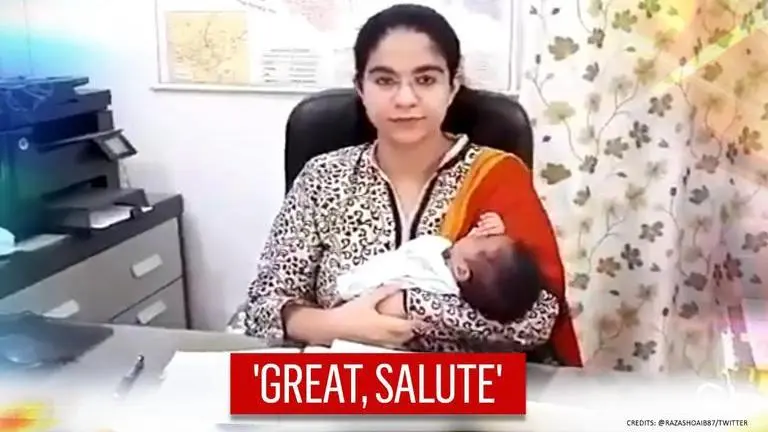 Video: UP official resumes duties with newborn in arms, netizens say 'proud of you' UP