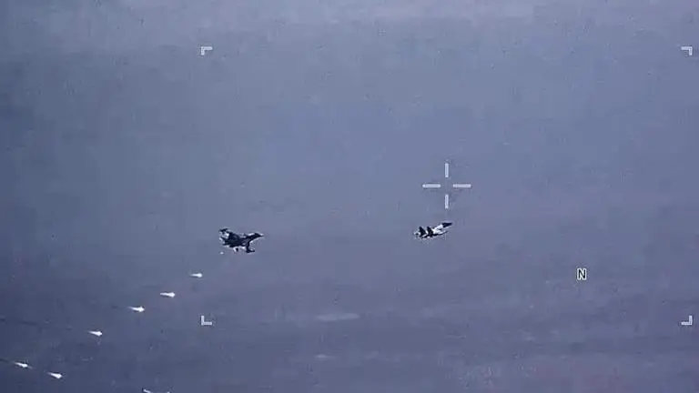 Russian fighter jets harass US drones over Syria for third day in a row, US military says In this image from video released by the U.S. Air Force, Russian military SU-34 and SU-35 aircraft release flares in the flight path of a U.S. Air For