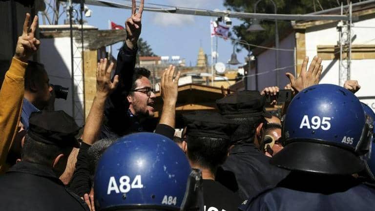 Cyprus police detain 13 after anti-immigrant protesters set fire to ...