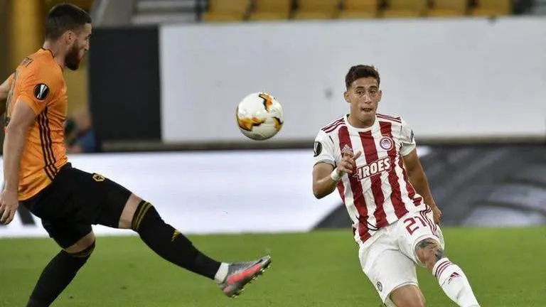 Liverpool signs left back Tsimikas from Olympiakos