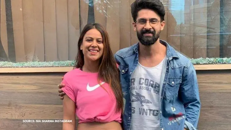 Nia Sharma sizzles in a bikini as she poses alongside 'Jamai Raja 2.0' co-star Ravi Dubey nia sharma