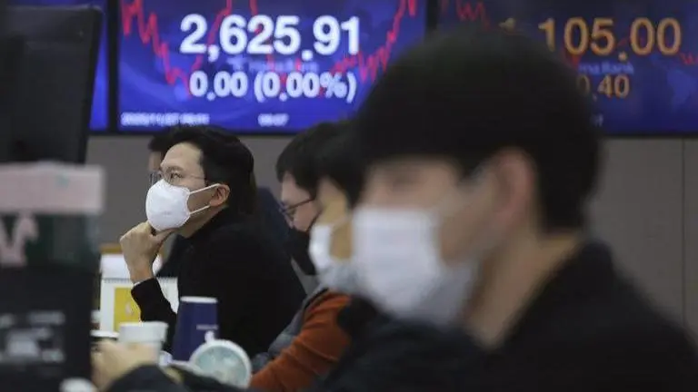 Asian stocks mixed amid unease about vaccine development
