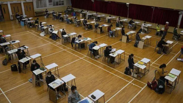 Hong Kong university entrance exams begin with virus steps