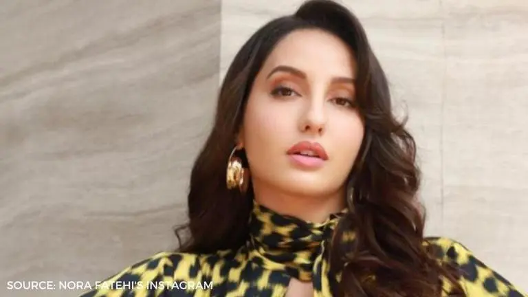Nora Fatehi takes 'beach bum' sticker literally in her holiday video! nora fatehi