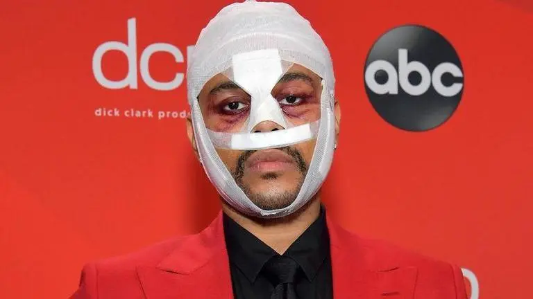 The Weeknd turns up at American Music Awards covered in bandages and bruises The Weeknd