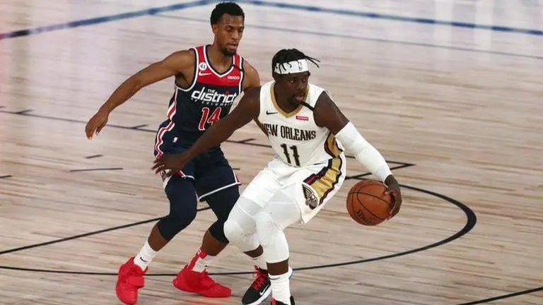 Holiday scores 28; Pelicans top Wizards without Williamson