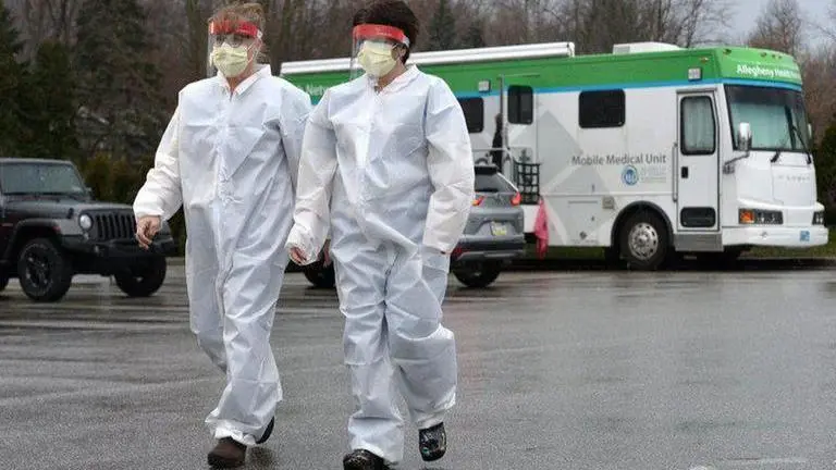 US locking down 70 million people as virus strains Europe
