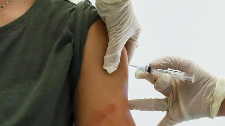 UK seeks to give 1st COVID shot to all adults by September