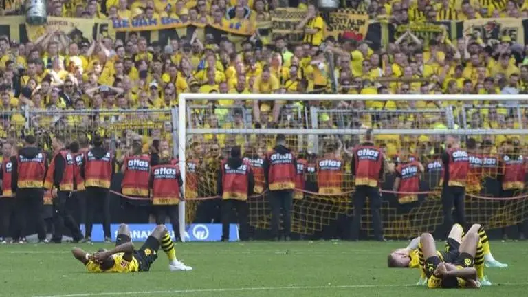 Borussia Dortmund's players, fans stunned after falling short in Bundesliga title race Borussia Dortmund