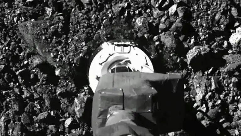 NASA spacecraft sent asteroid rubble flying in sample grab NASA spacecraft sent asteroid rubble flying in sample grab