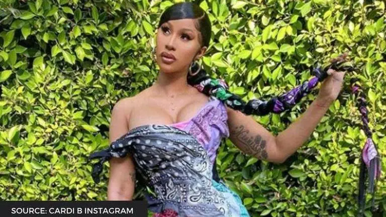 Cardi B tells fans to "Stop with the Illuminati" theories after they comment "lucifer" Cardi B