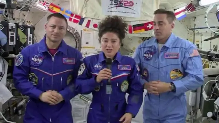 After months in space, three astronauts return to Earth
