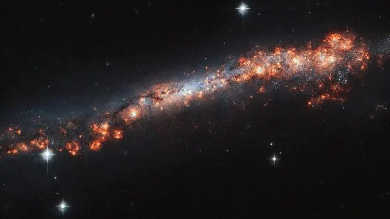 In a first, astronomers peer furthest in time to observe slow spin of distant galaxy galaxy