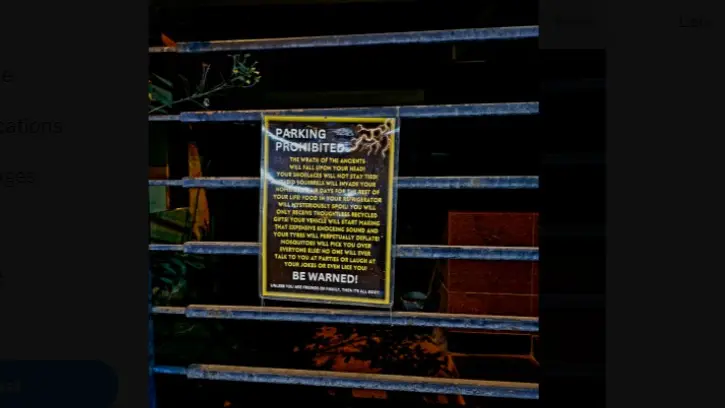 The ominous message reads: “Parking prohibited. The wrath of the ancients will fall upon your head! Your shoelaces will not stay tied! Rabid squirrels will invade your home.
