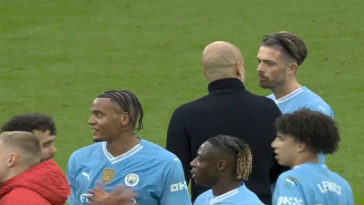 Pep Guardiola and Jack Grealish