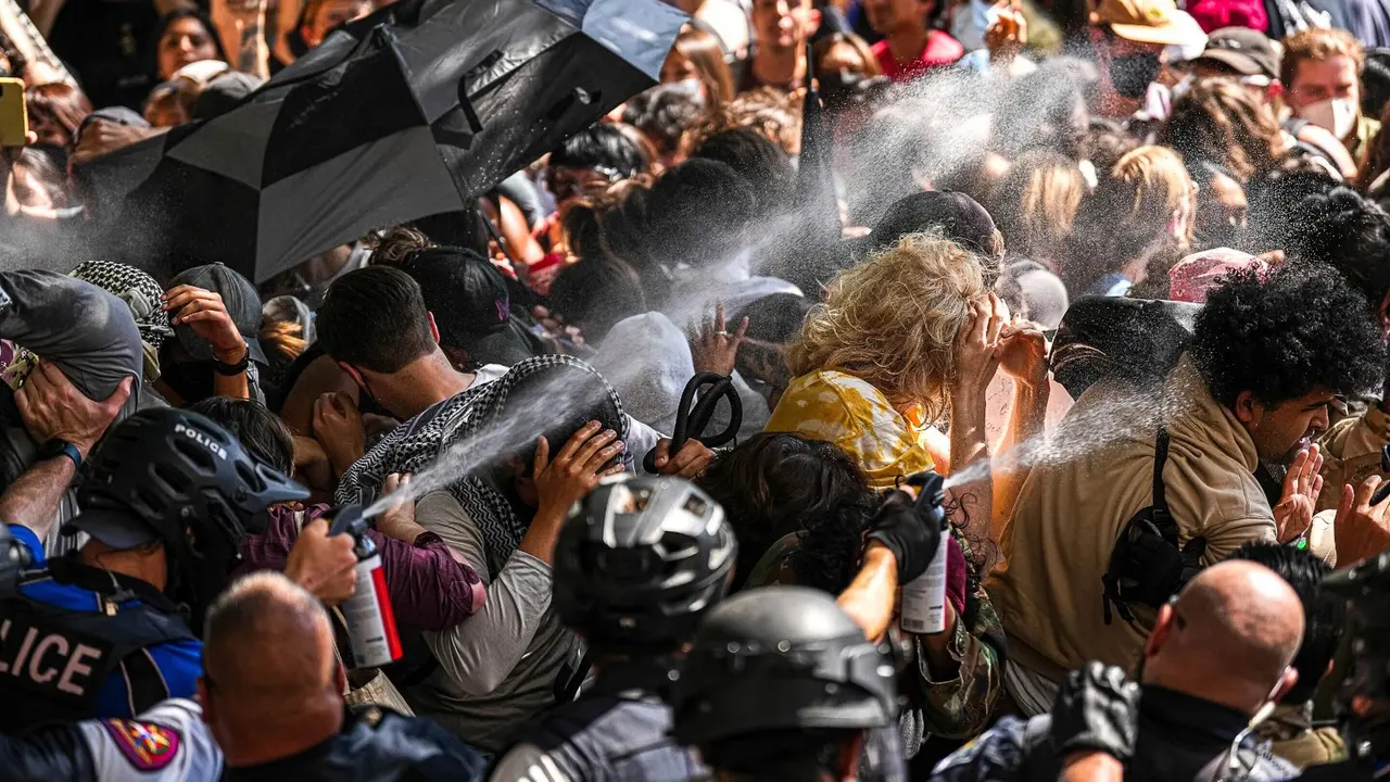 Student Journalists Are Put to the Test, and Sometimes Face Danger, in Covering Protests on Campus Police pepper spray pro-Palestinian protesters blocking police vehicles from leaving the University of Texas in Austin, Texas, Monday, April 29, 2024.