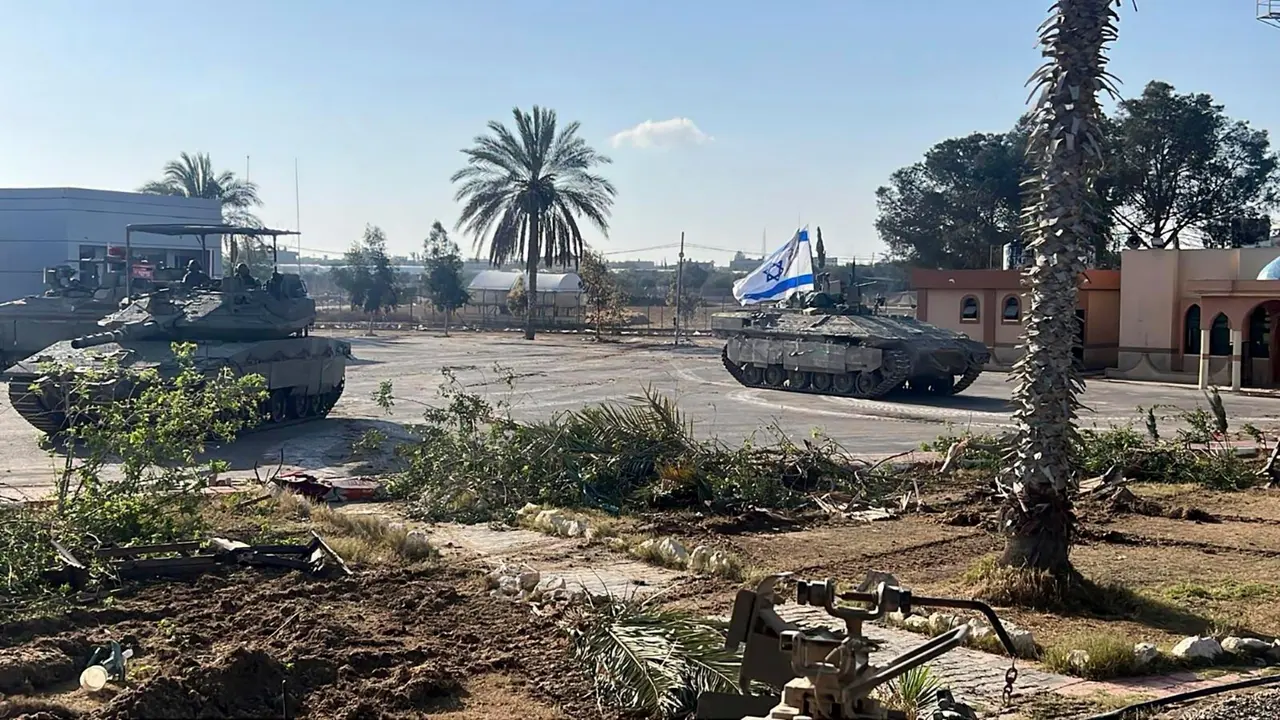 Israel May Have Violated Humanitarian Law in Gaza Using American Weapons: US This photo provided by the Israel Defense Forces shows a tank with an Israel flag on it entering the Gazan side of the Rafah border crossing on Tuesday, May 7, 2024.