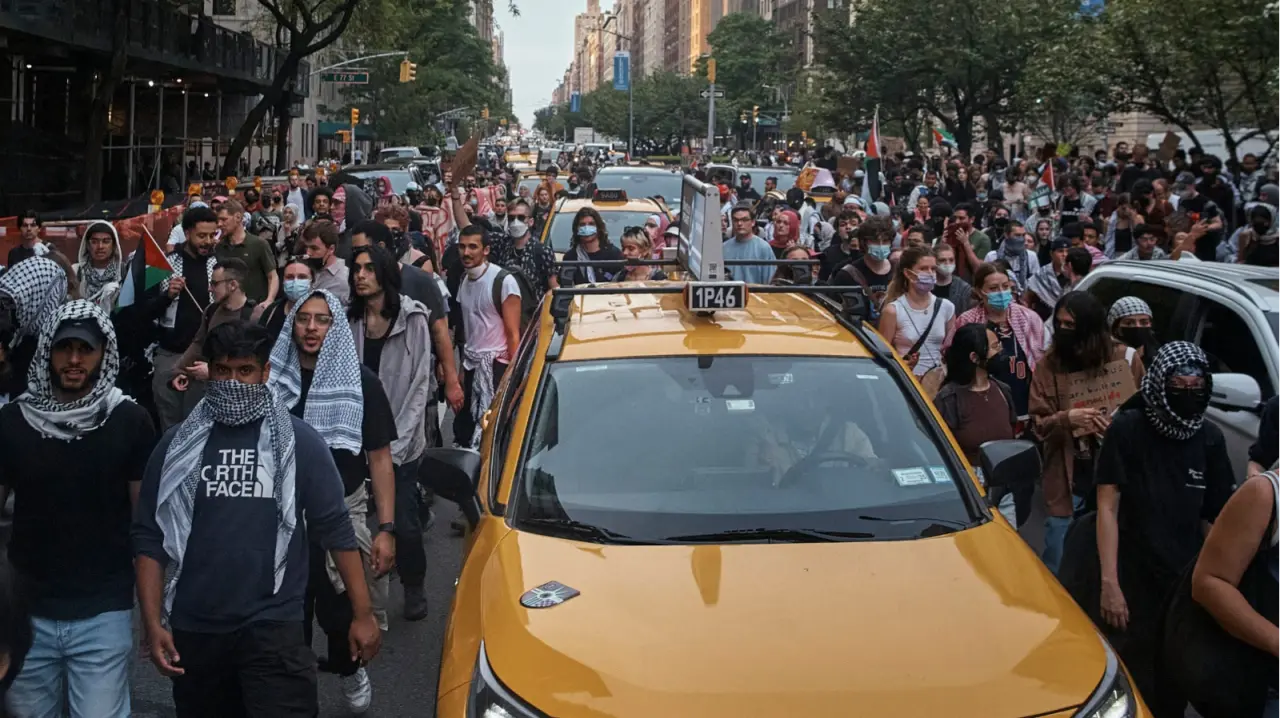 Pro-Palestinian protesters march in between traffic near the Metropolitan Museum of Art, where the Met Gala takes place, May 6, 2024, in New York.