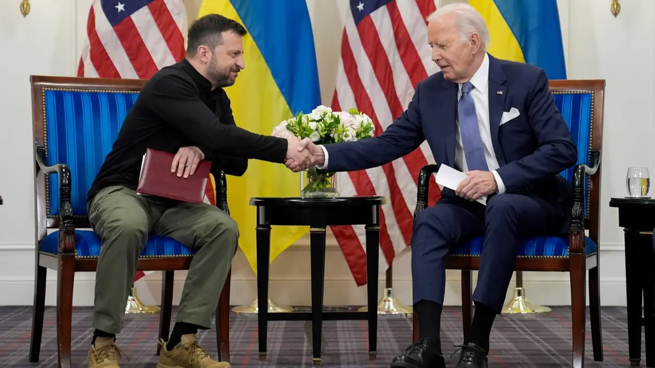 Biden and Zelenskyy Will Sign a Security Deal, as G7 Leaders Agree to Use Russian Cash to Help Kyiv U.S. President Joe Biden shakes hands with Ukrainian President Volodymyr Zelenskyy in Paris, June 7, 2024.