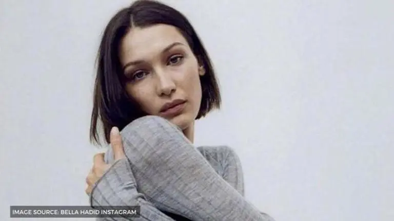 Bella Hadid poses topless before a mirror with a burrito, urges fans to stay inside; See Bella Hadid