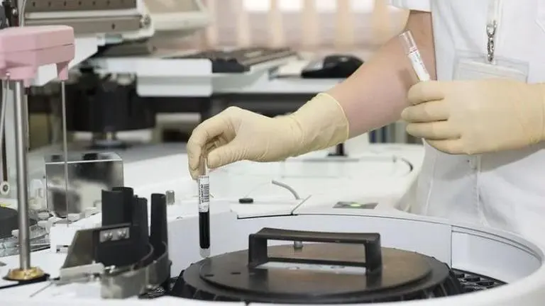 China's drug company says its treatment could potentially 'inhibit' Covid-19 China