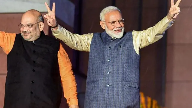 Amit Shah congratulates PM Modi on beginning of 20th year as public representative