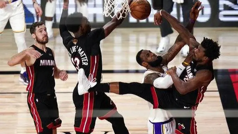 Lakers win 17th NBA title equaling Boston record, after beating Heat 106-93 Lakers win 17th NBA title equaling Boston record, after beating Heat 106-93