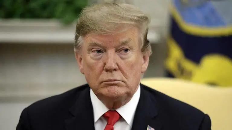 Trump signs order to prioritise Americans for COVID vaccine, critics say 'publicity stunt' Donald Trump