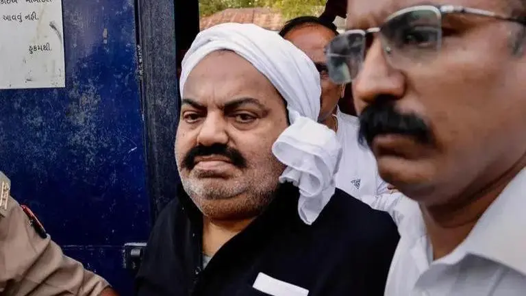 'I'm reduced to dust, spare my family', pleads Ateeq Ahmed from inside police van 'I'm reduced to dust, spare my family', pleads gangster-politician Ateeq Ahmed