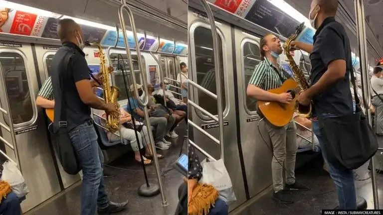 Musical duo playing sax & guitar in subway train leaves viewers awestruck; WATCH Man play saxophone