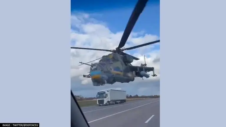 Ukraine's assault helicopter barely misses vehicles on busy highway; watch Ukraine